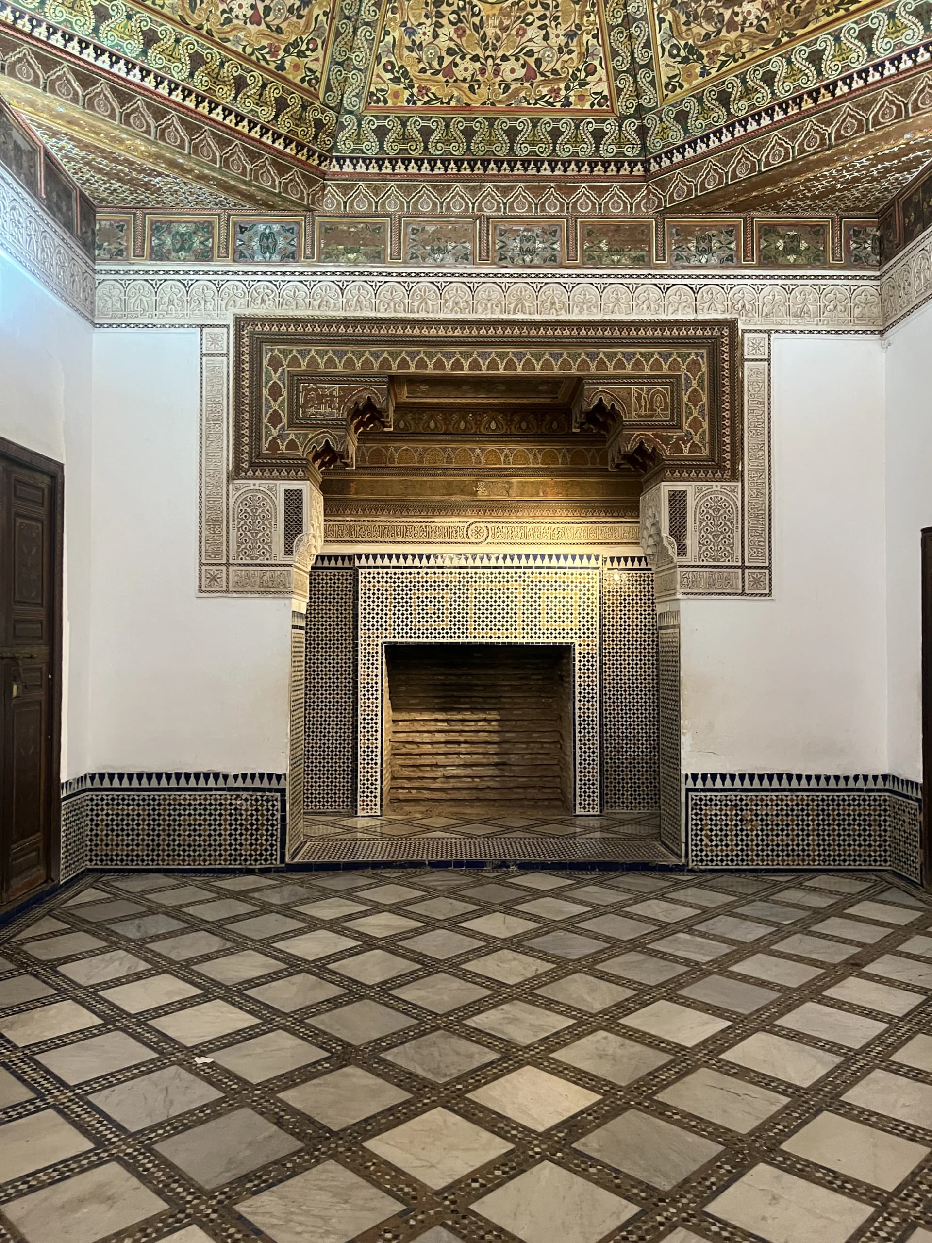 Grand decorated doorway with blue zellige tilework, Bahia Palace Marrakech