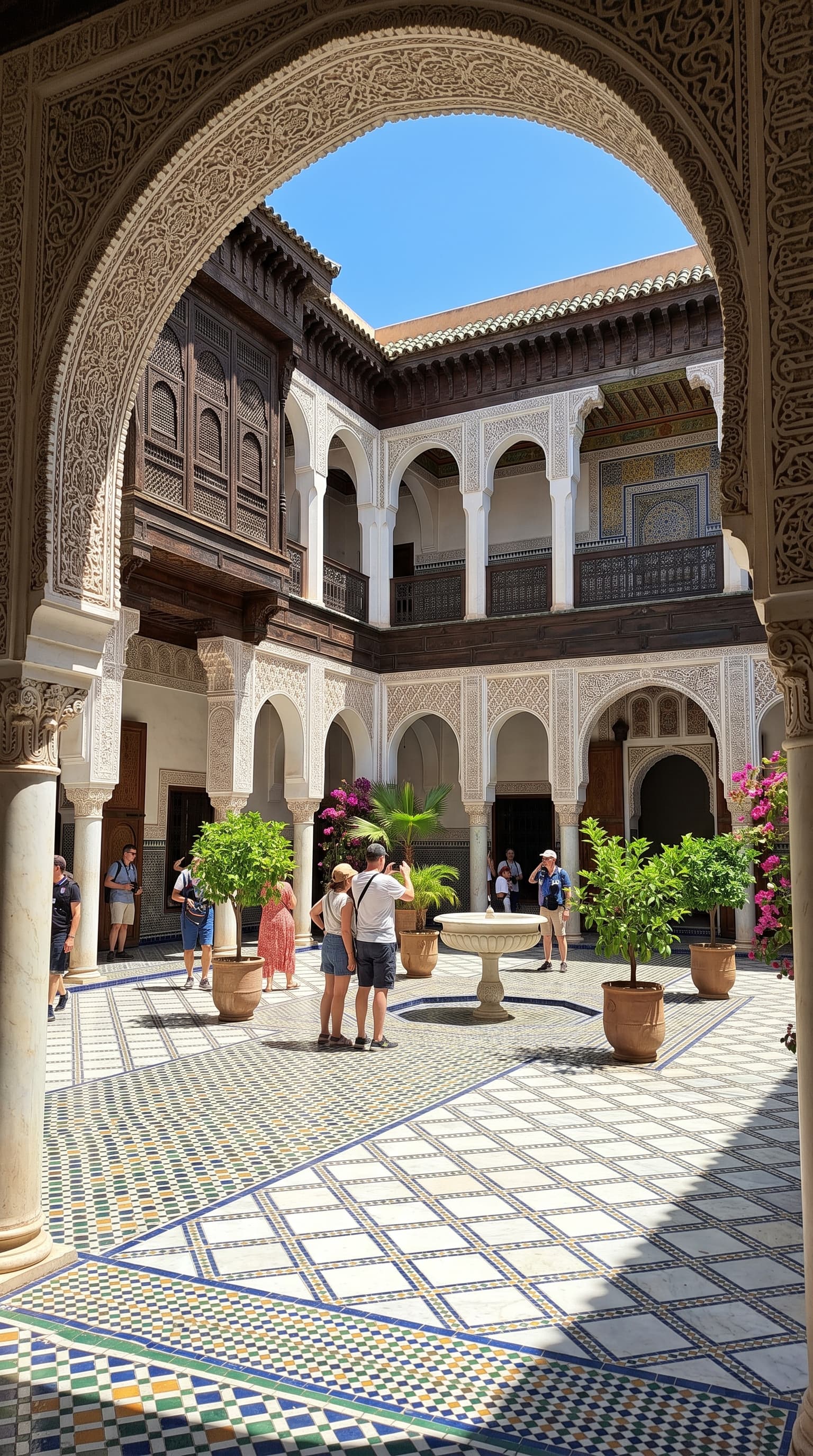 Bahia Palace interior courtyard with carved arches and mosaic tiles Marrakech
