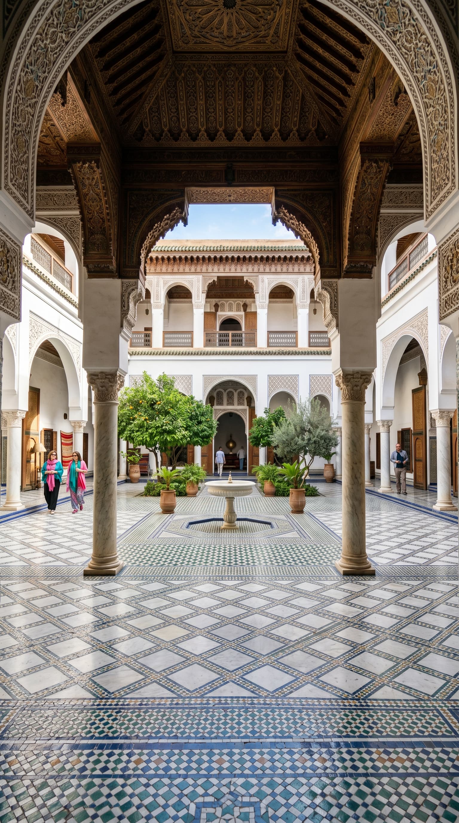 Bahia Palace marble courtyard with Moroccan fountain and arches Marrakech