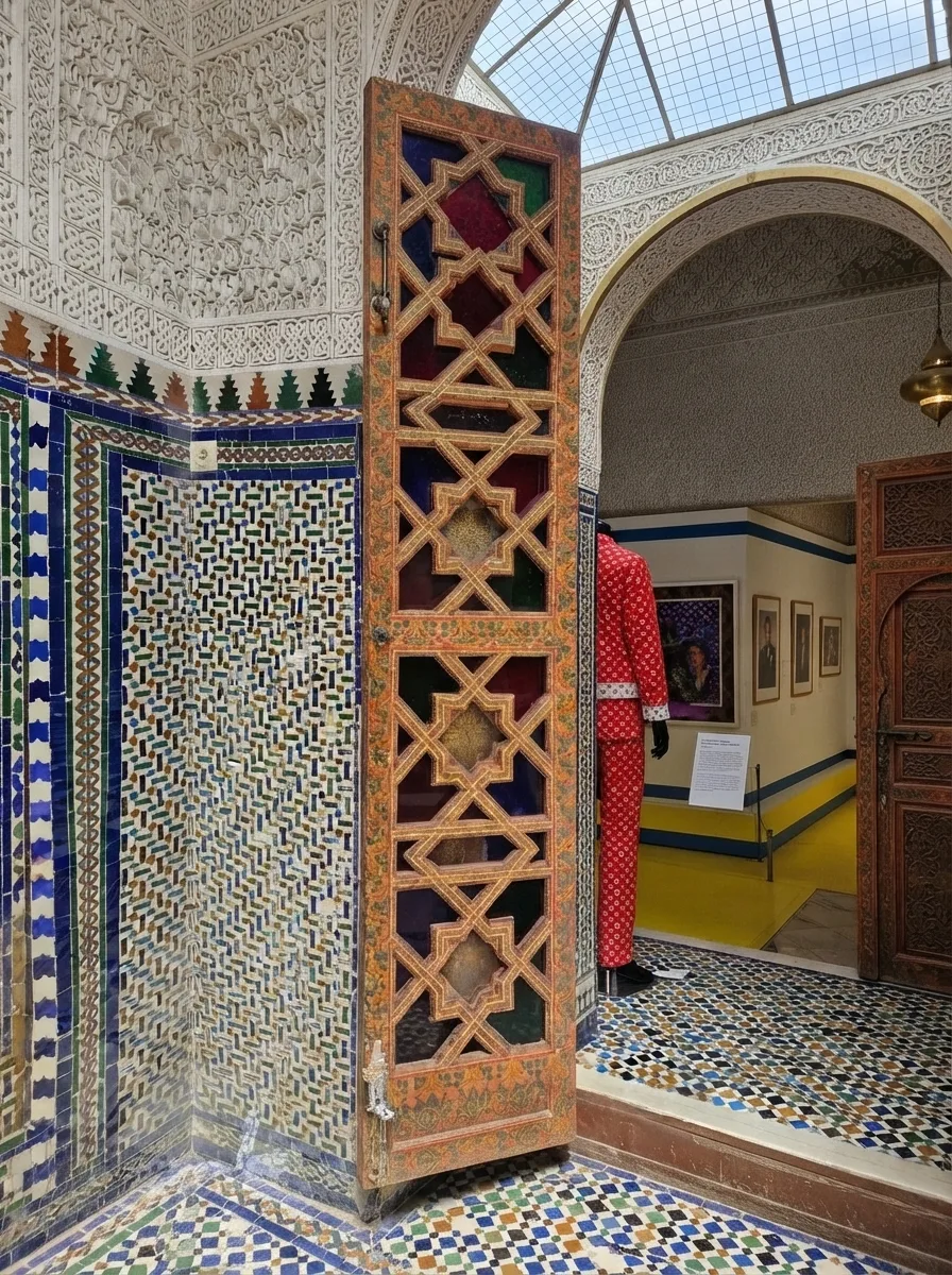 Small private courtyard with fountain and carved plaster in the family quarters of Bahia Palace